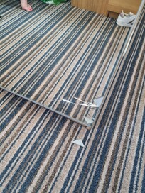 Glass on the floor, from a broken mirror