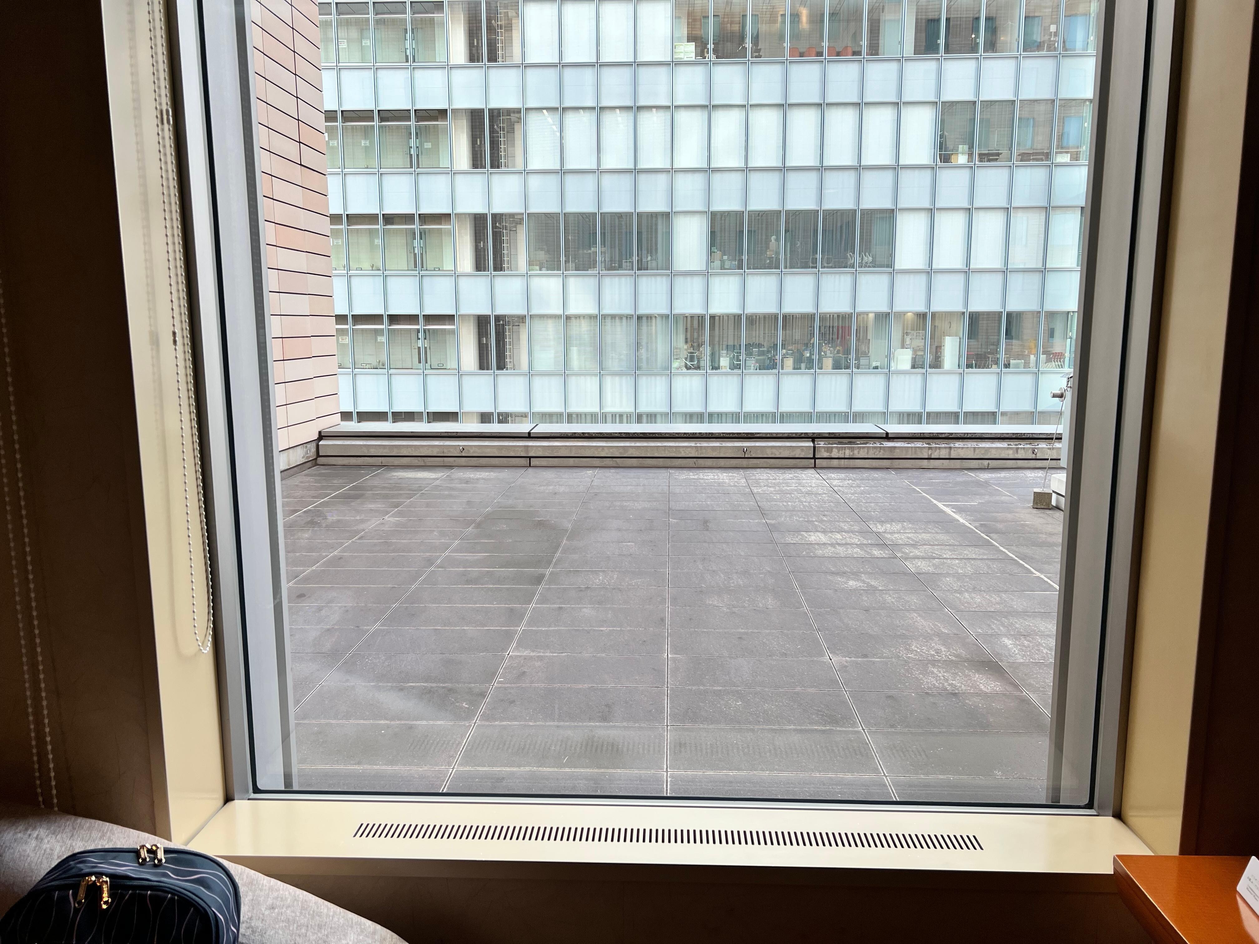 Room facing a rooftop.