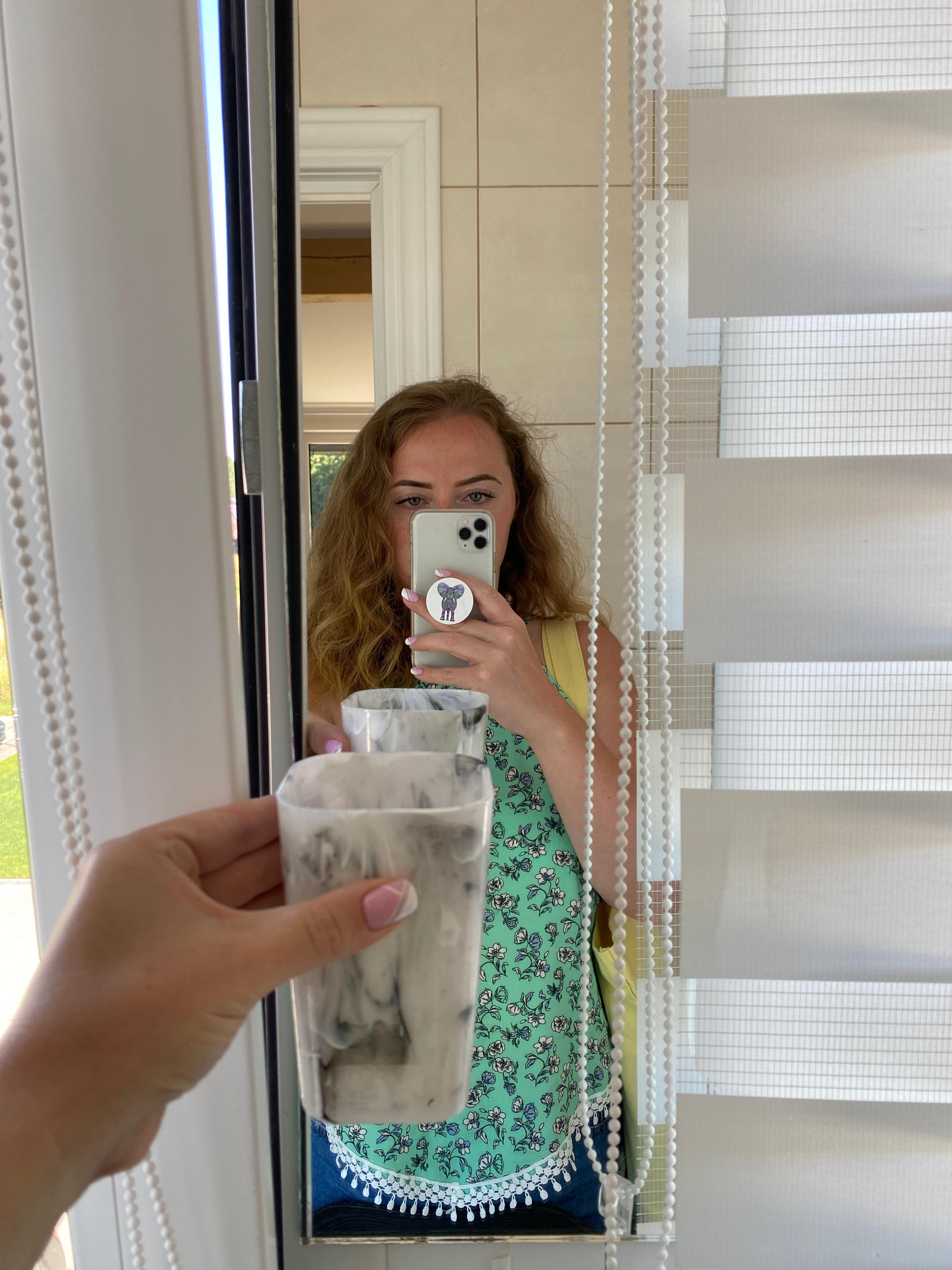 Size of the bathroom mirror compared to the toothbrush holder partially obstructed by the window blind. I’m stood by the other wall, husband didn’t see his full face when shaving