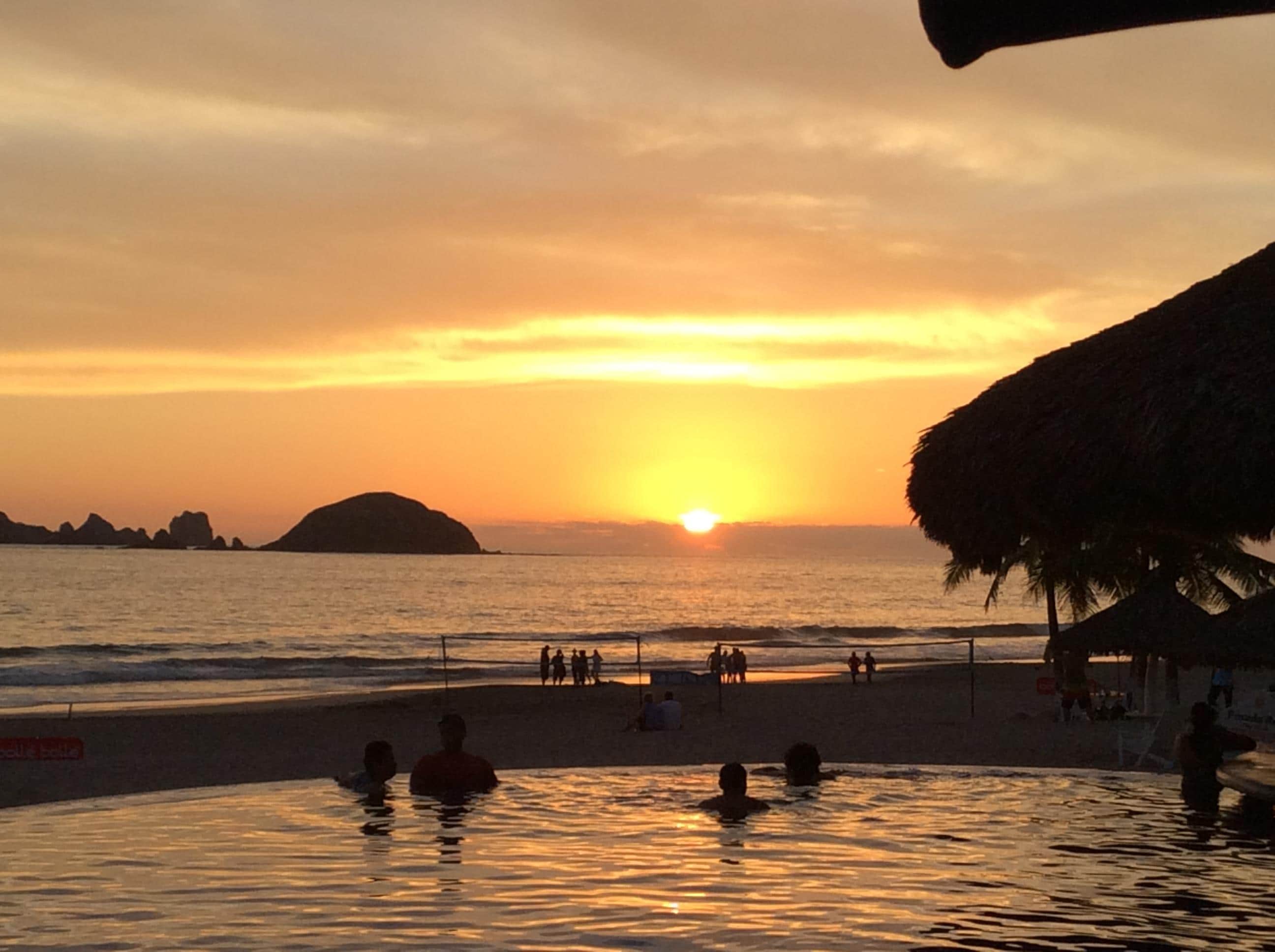 Sunset over the pool and ocean