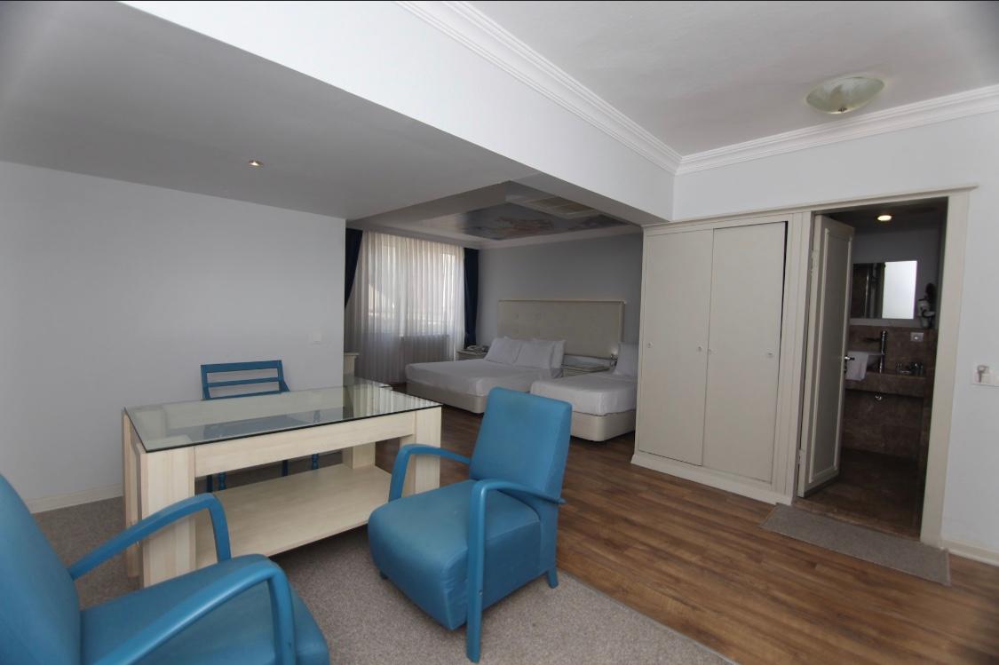 This is the online photo of the room for 3 that we booked through “Hotels.com”, which has a separate sitting area as shown in the photo/advertisement 