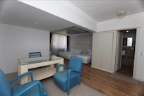 This is the online photo of the room for 3 that we booked through “Hotels.com”, which has a separate sitting area as shown in the photo/advertisement