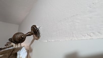 Curtain rails hanging off