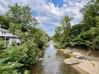 Looking down River from outside grounds below lodge
