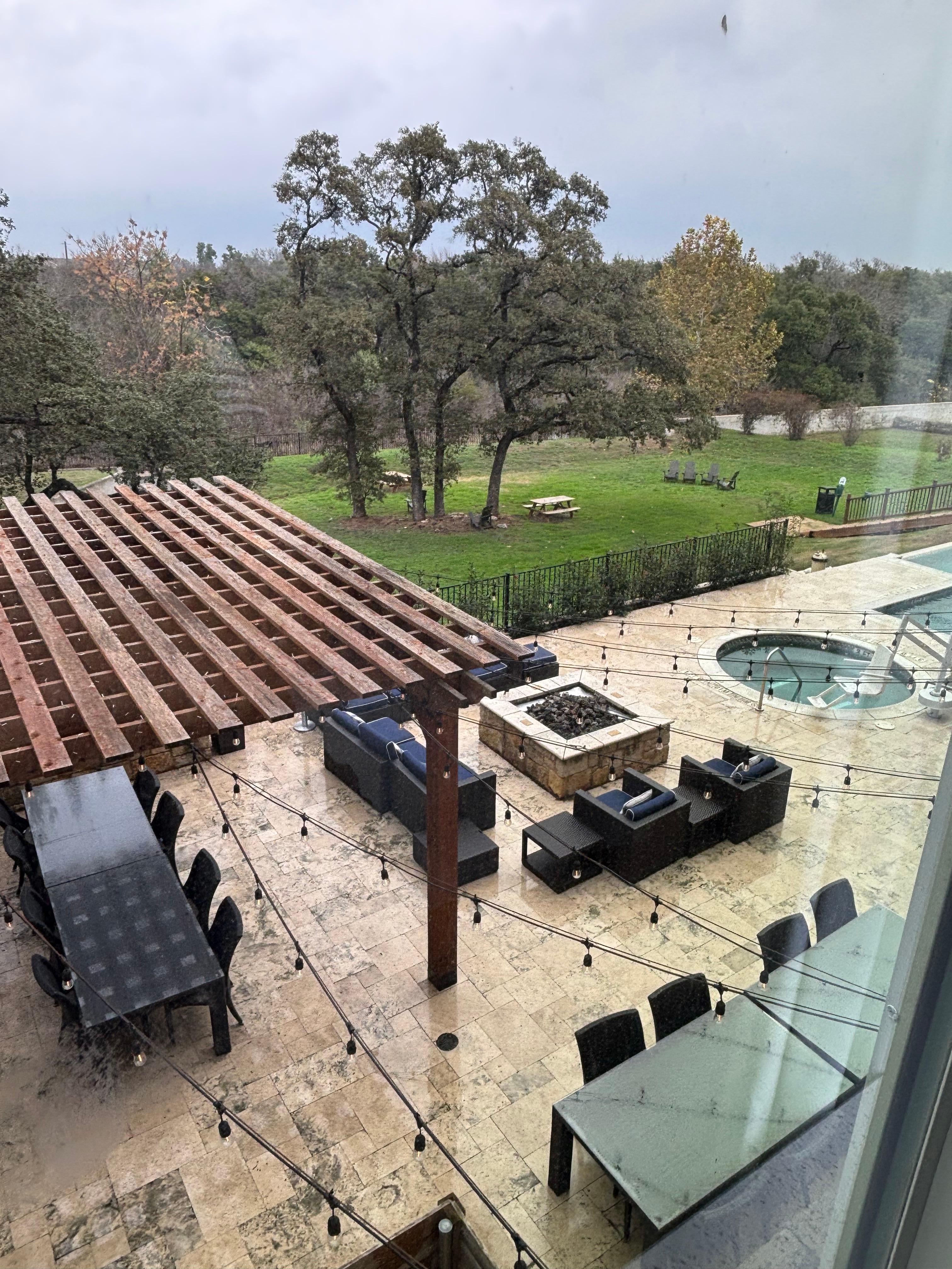 Lovely outdoor patio, fire pit, pool and grassy yard. 