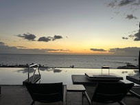 Roof top pool and sunset.