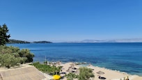 The local beach. 5 mins away. Does great lunches and drinks. Sunbeds just 3 Euros for the day.