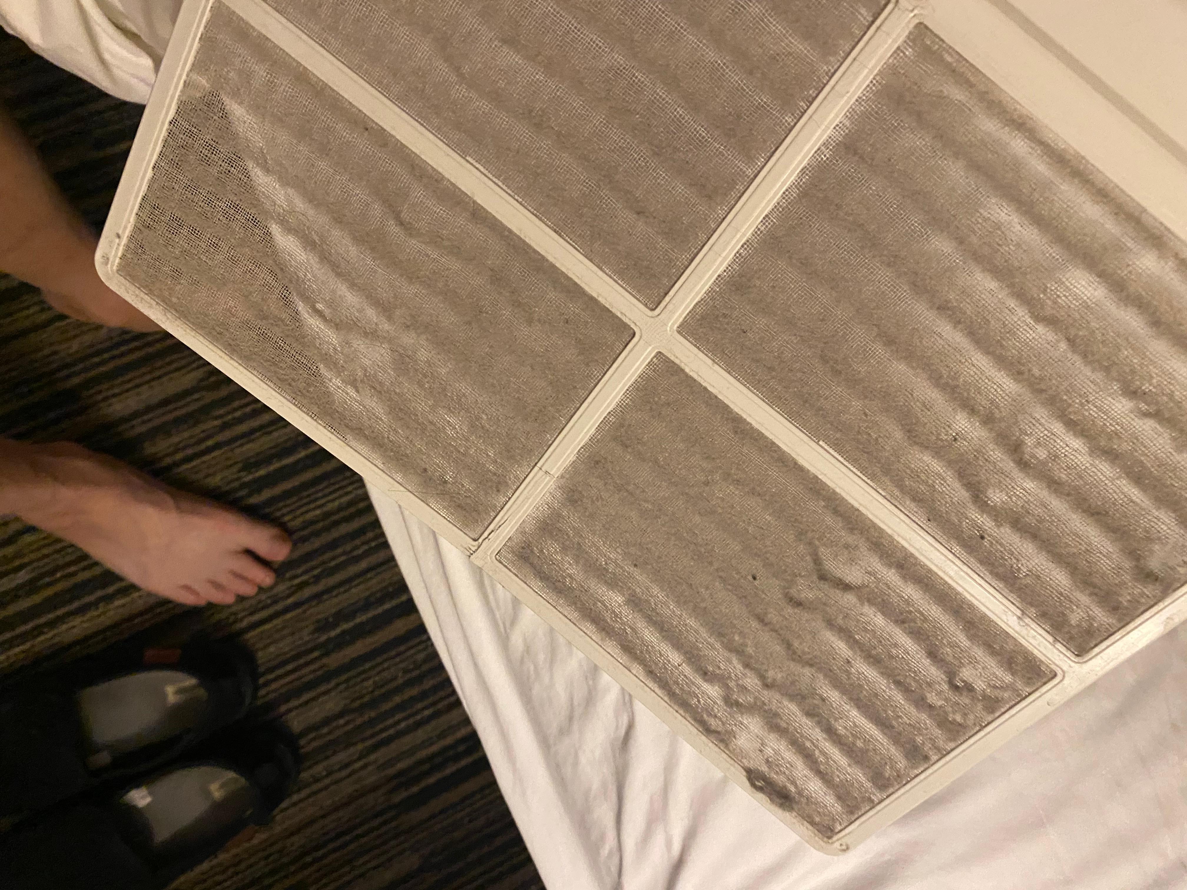 Filthy air filter on room heat and a/c unit