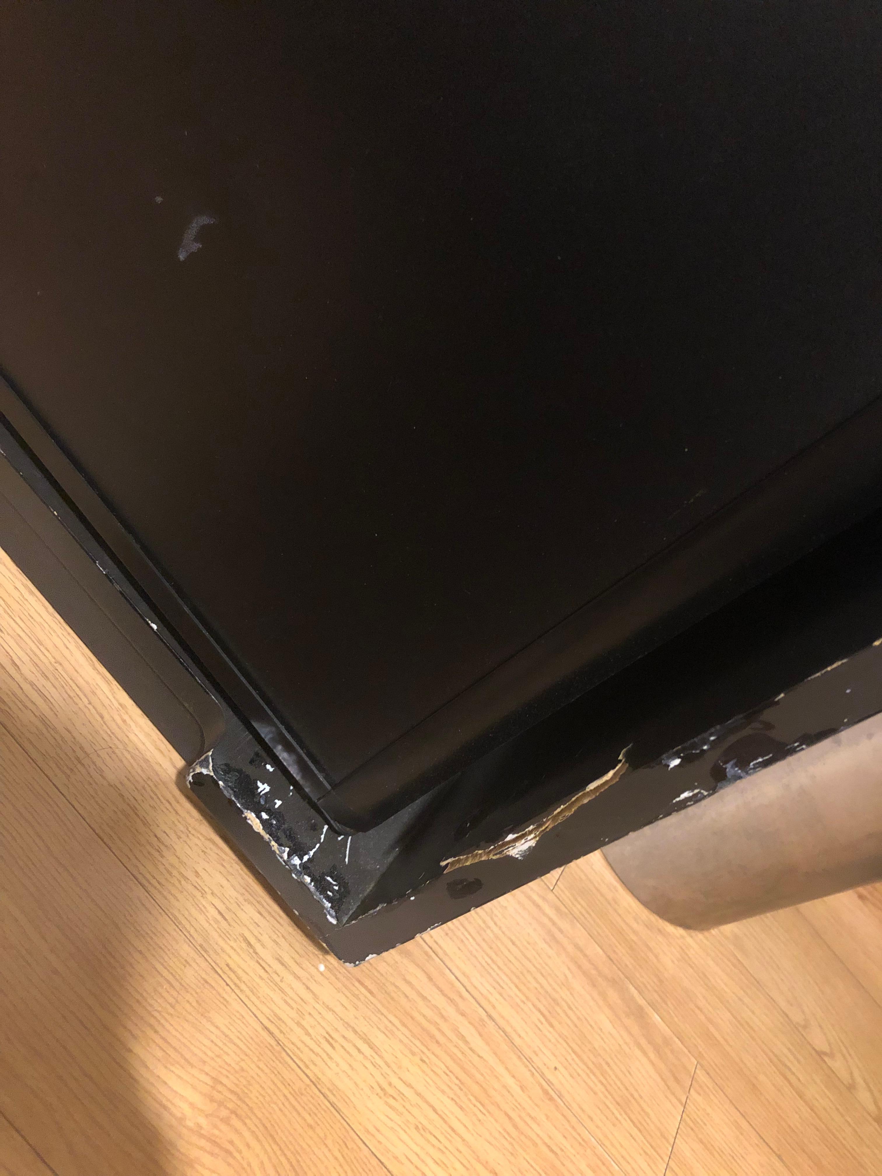 The cabinet that holds the mini fridge was super banged up, as was the side table