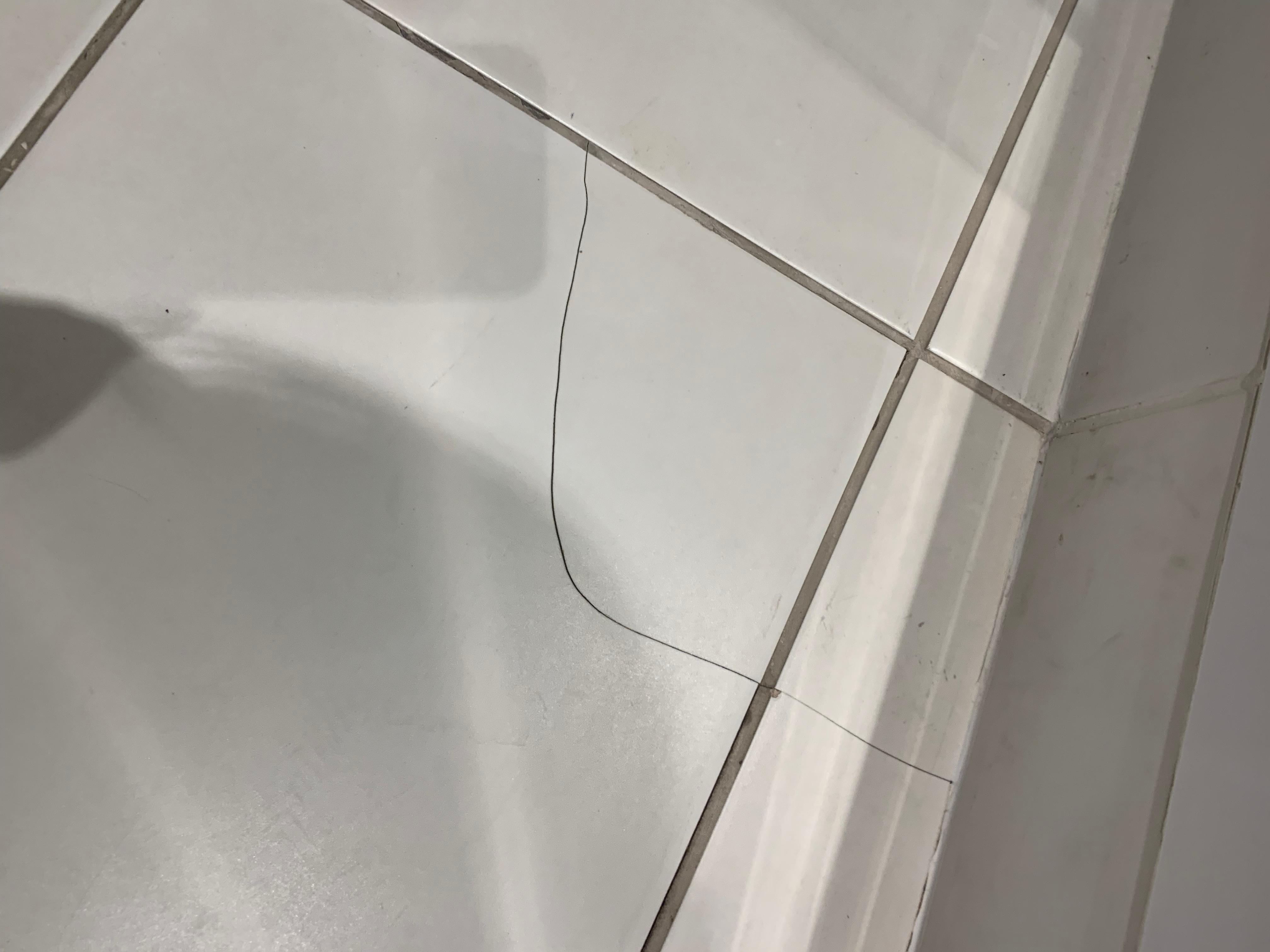 Bathroom floor tiles cracked