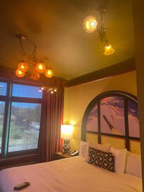 View of the bed with artistic headboard