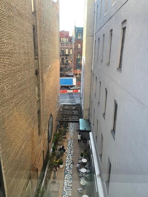 View from our window to the cafe in the alley.
