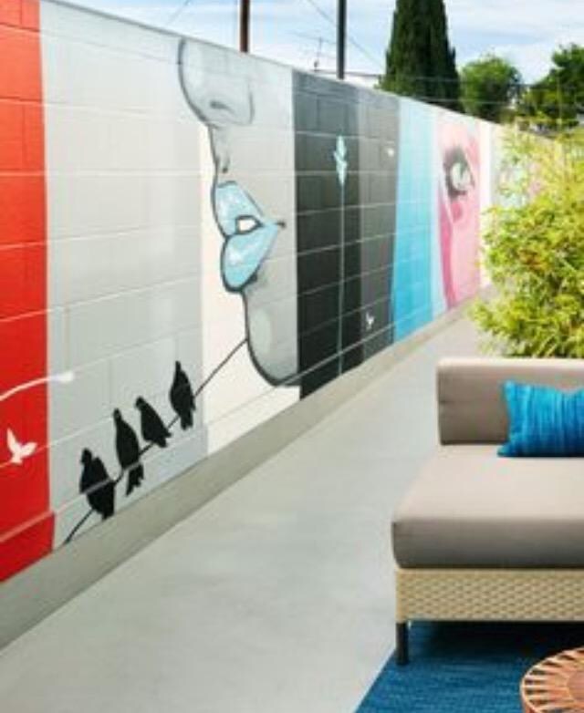 This is what you see when you stand on the patio. The artwork is beautiful however I am visiting and I would love to enjoy to view of the mountains that is behind this wall. However, it's not possible because of the wall.