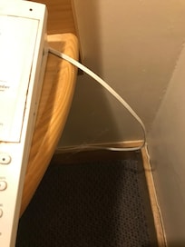 Cobwebs next to double bed.