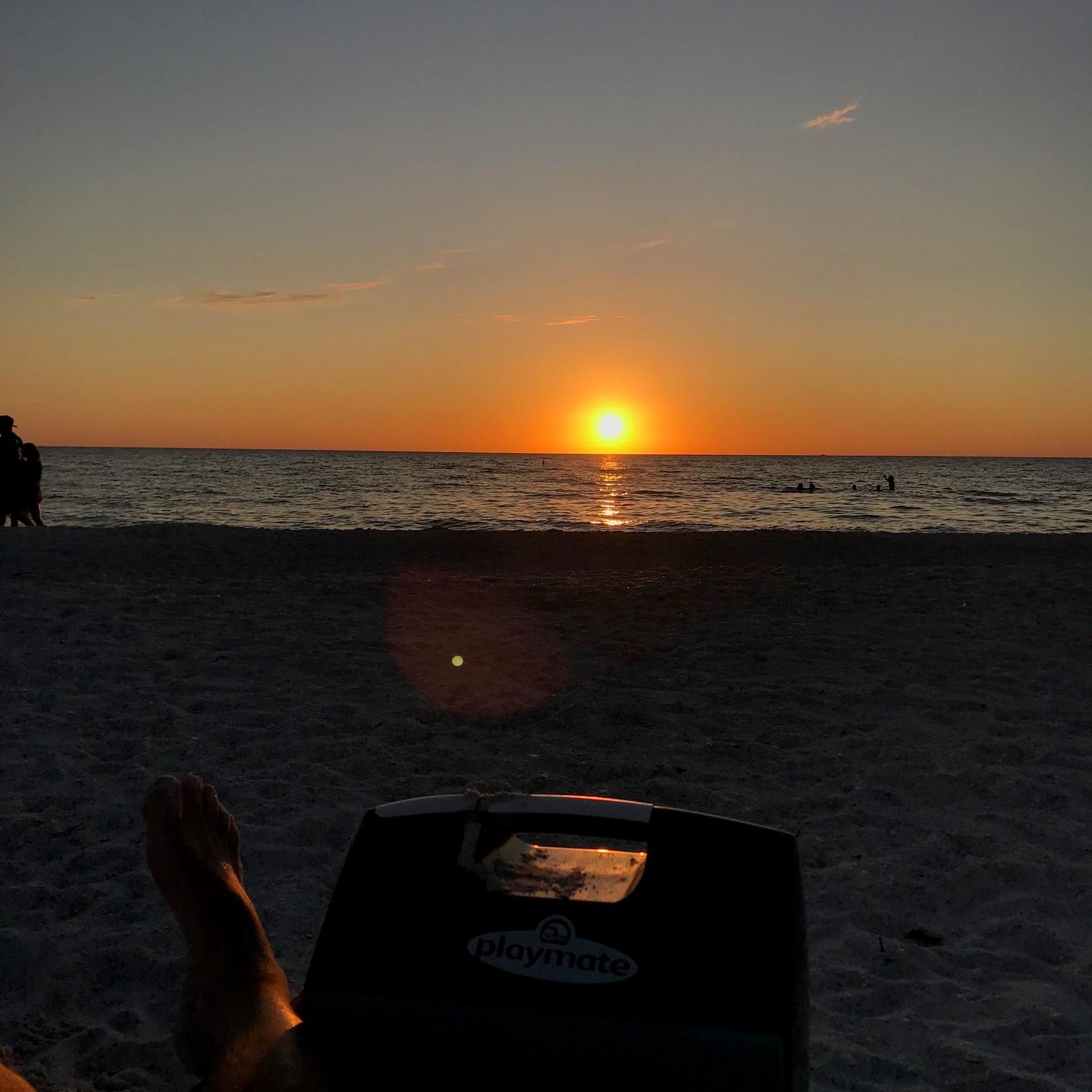 Sunset on beach directly behind condo.