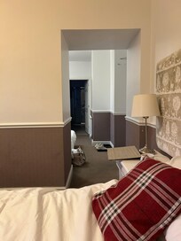 Double bed in one part , 2 single beds in the other.