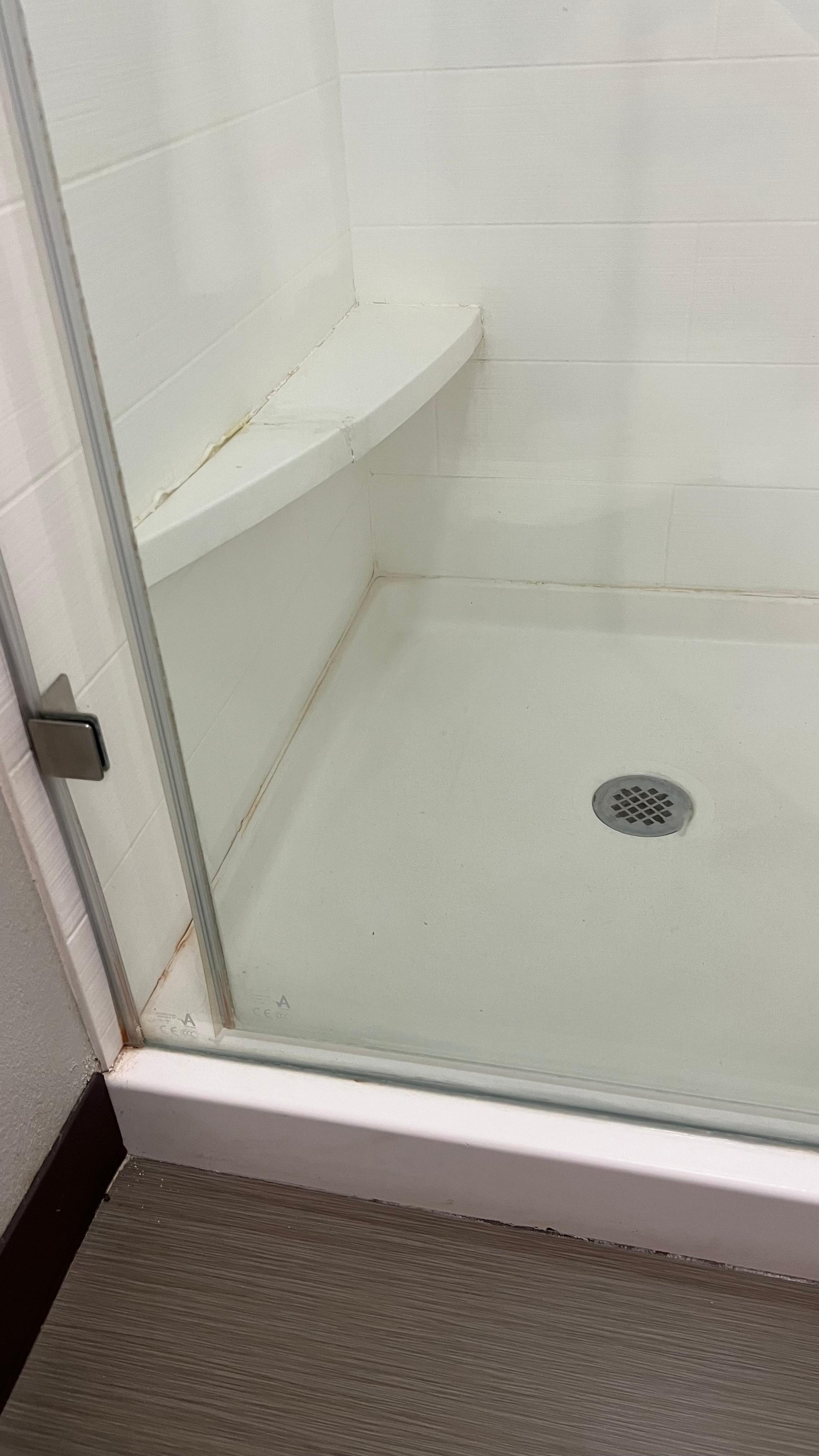 Broken ledge in shower for foot rest. 