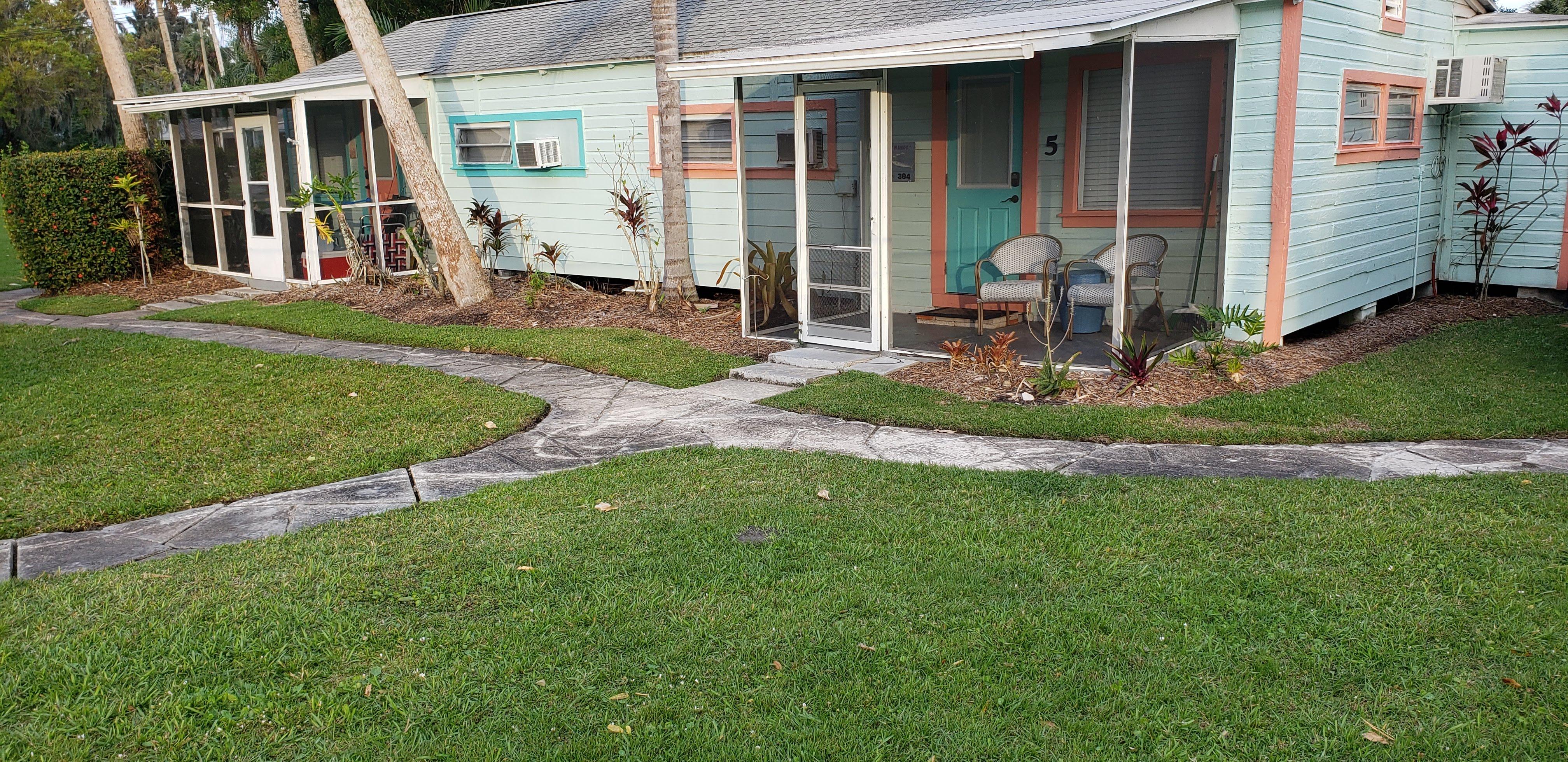 low lying cottages with mulch to divert rainwater away from foundation