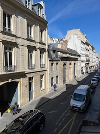 Street view below- 3 large windows that opened over quiet street below
