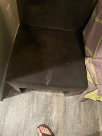 Stained chair and the only one in room.