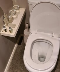 Glasses in line with the toilet definitely not hygienic