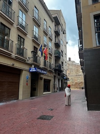 Mom in front of the hotel.