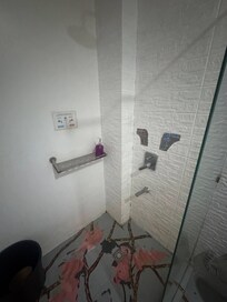 disgusting shower with contradicting hot and cold instructions