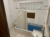 Very cheaply and poorly made bathroom bathroom. Looks like this room was converted from a storage unit.