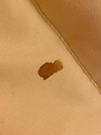 Old blood stains on the bedspread