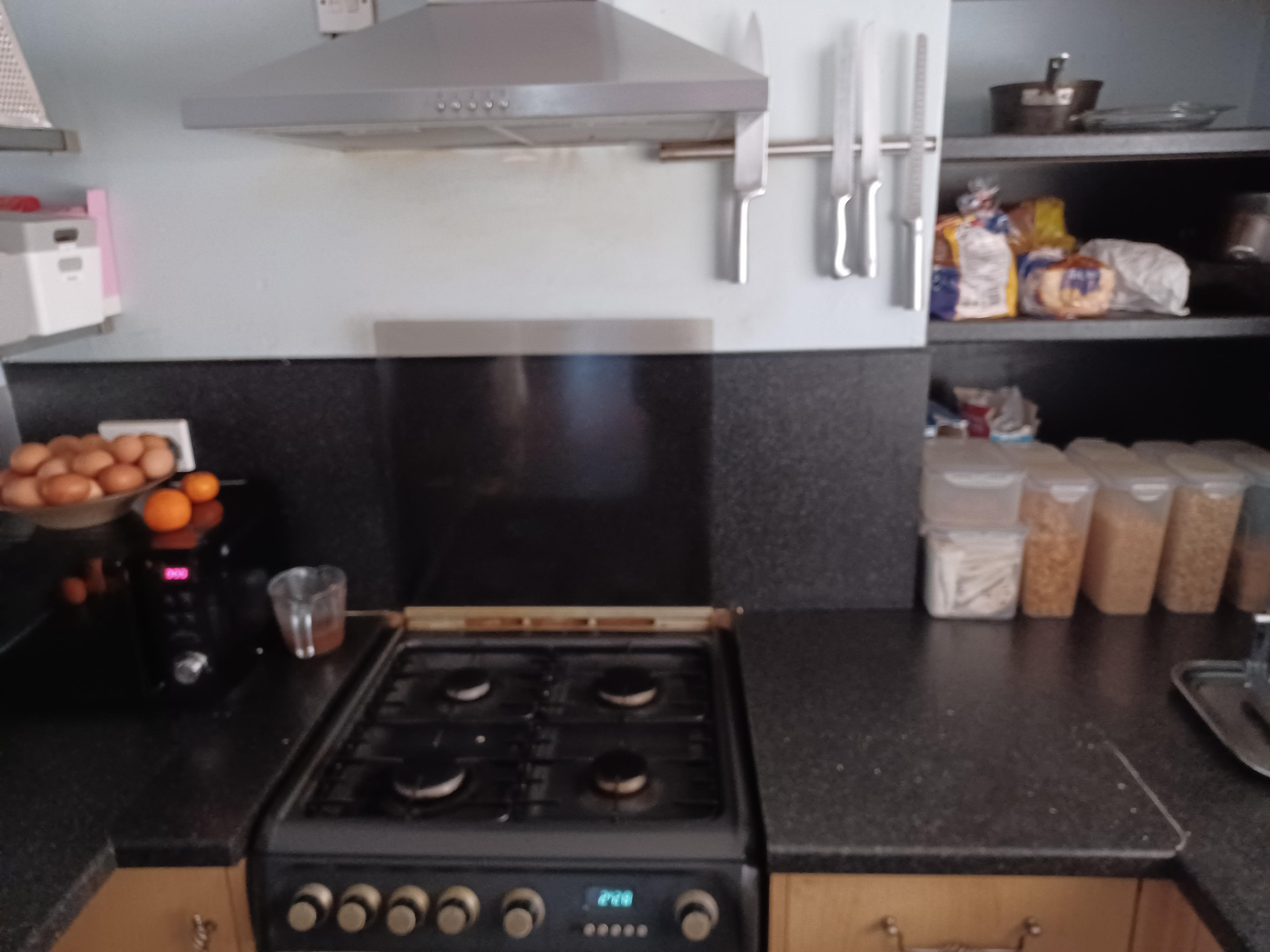 Kitchen stove and cereal choices.