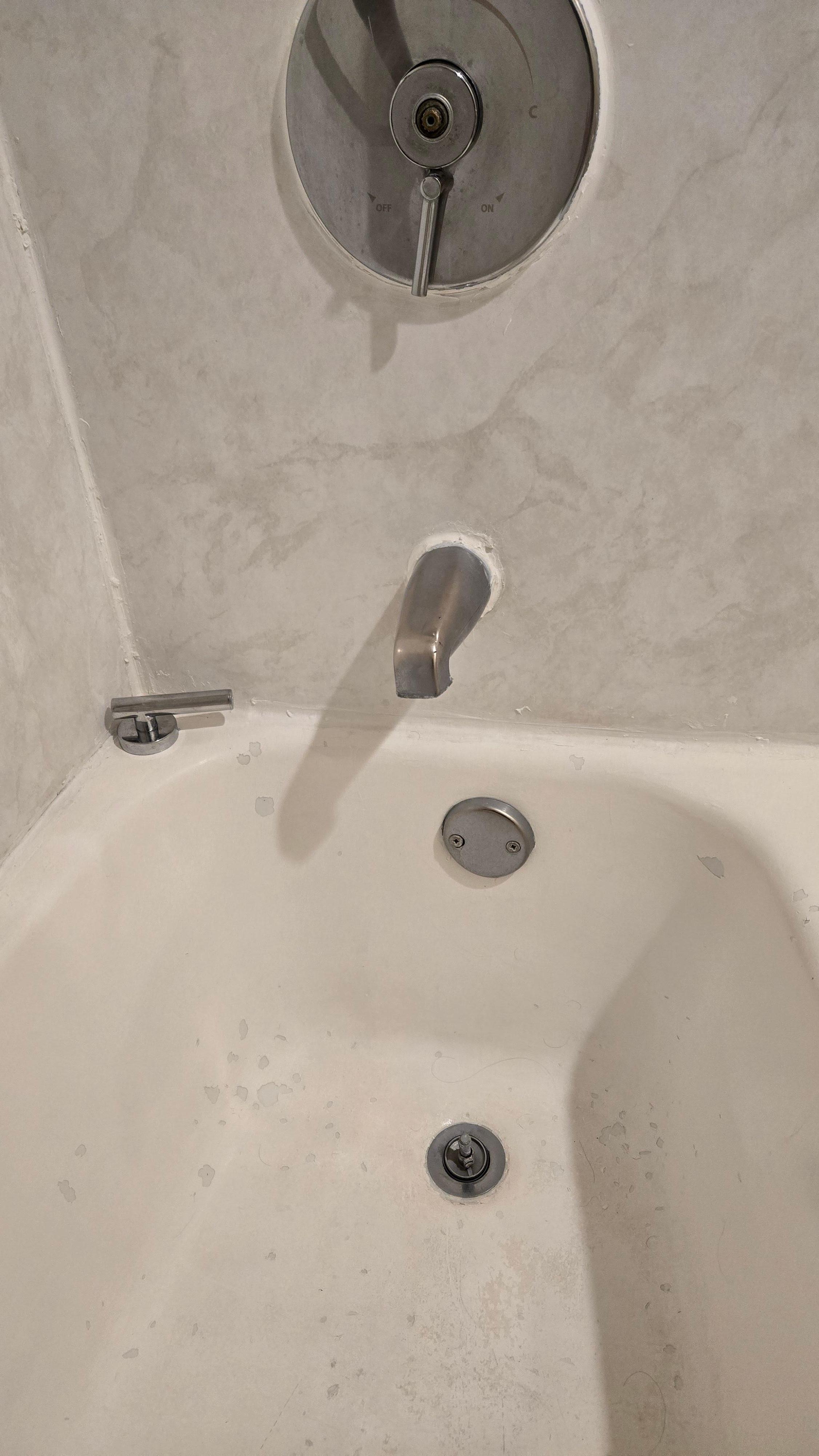 Bathtub spicket handle fell off and tub looked like it had leprosy. Toilet whistled while refilling. Waistful when trying to get hot water. 