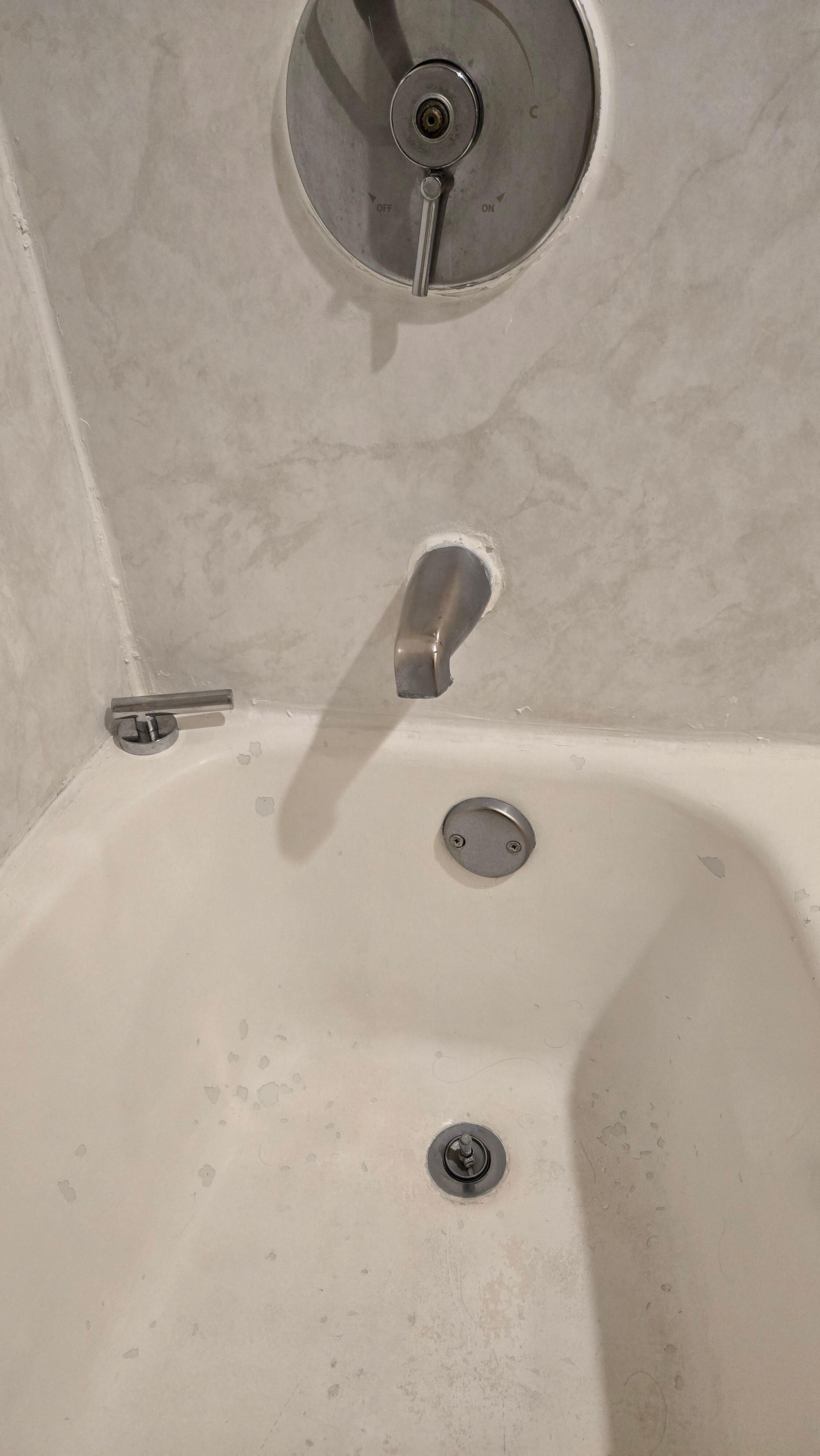Bathtub spicket handle fell off and tub looked like it had leprosy. Toilet whistled while refilling. Waistful when trying to get hot water.