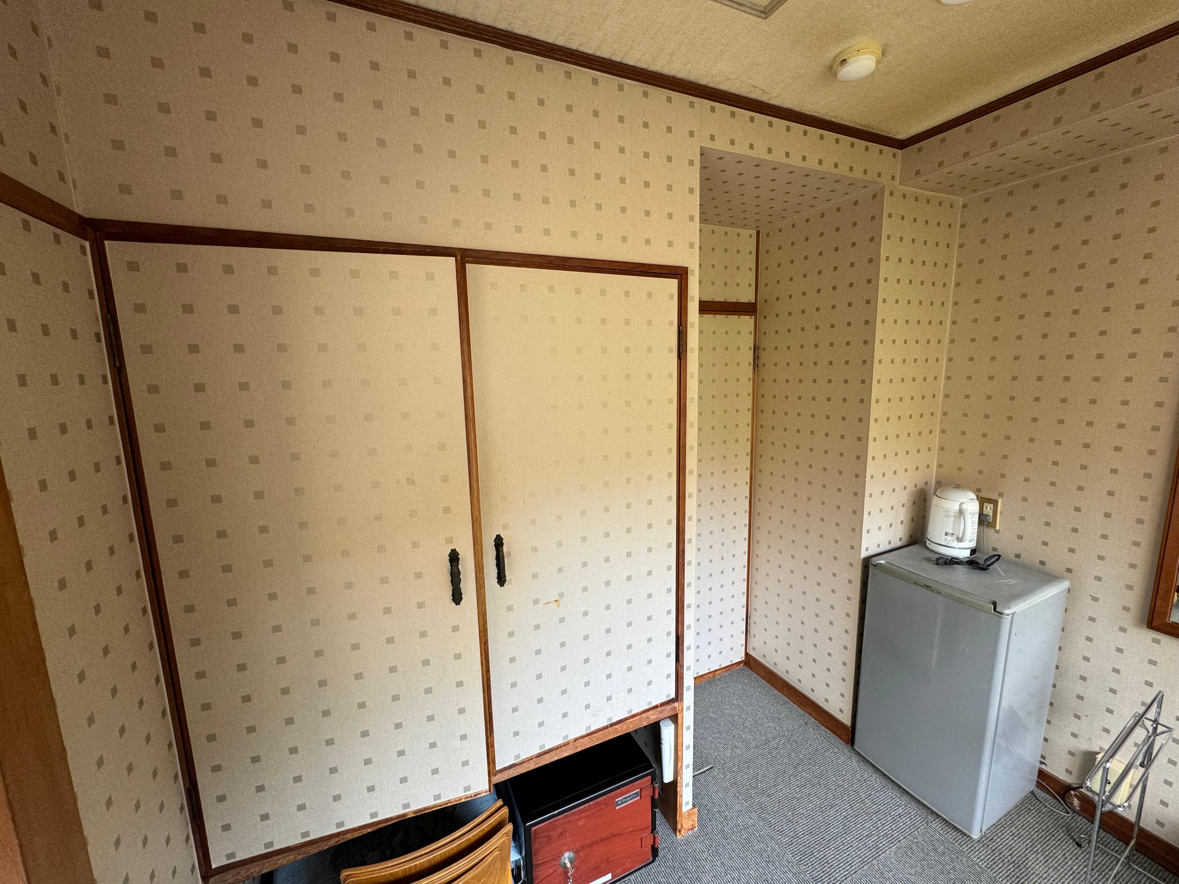 Appliances quite dated including mini fridge (right) and in room safe (centre down) 