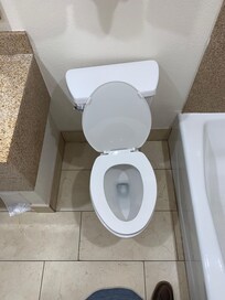 The lopsided and crooked toilet in room 238