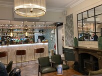 Part of the bar with seating area, adjoining one of the lounges