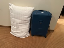 The only pillow in the room was bigger than my suitcase