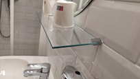Lop-sided shelving kept dumping items into the sink.