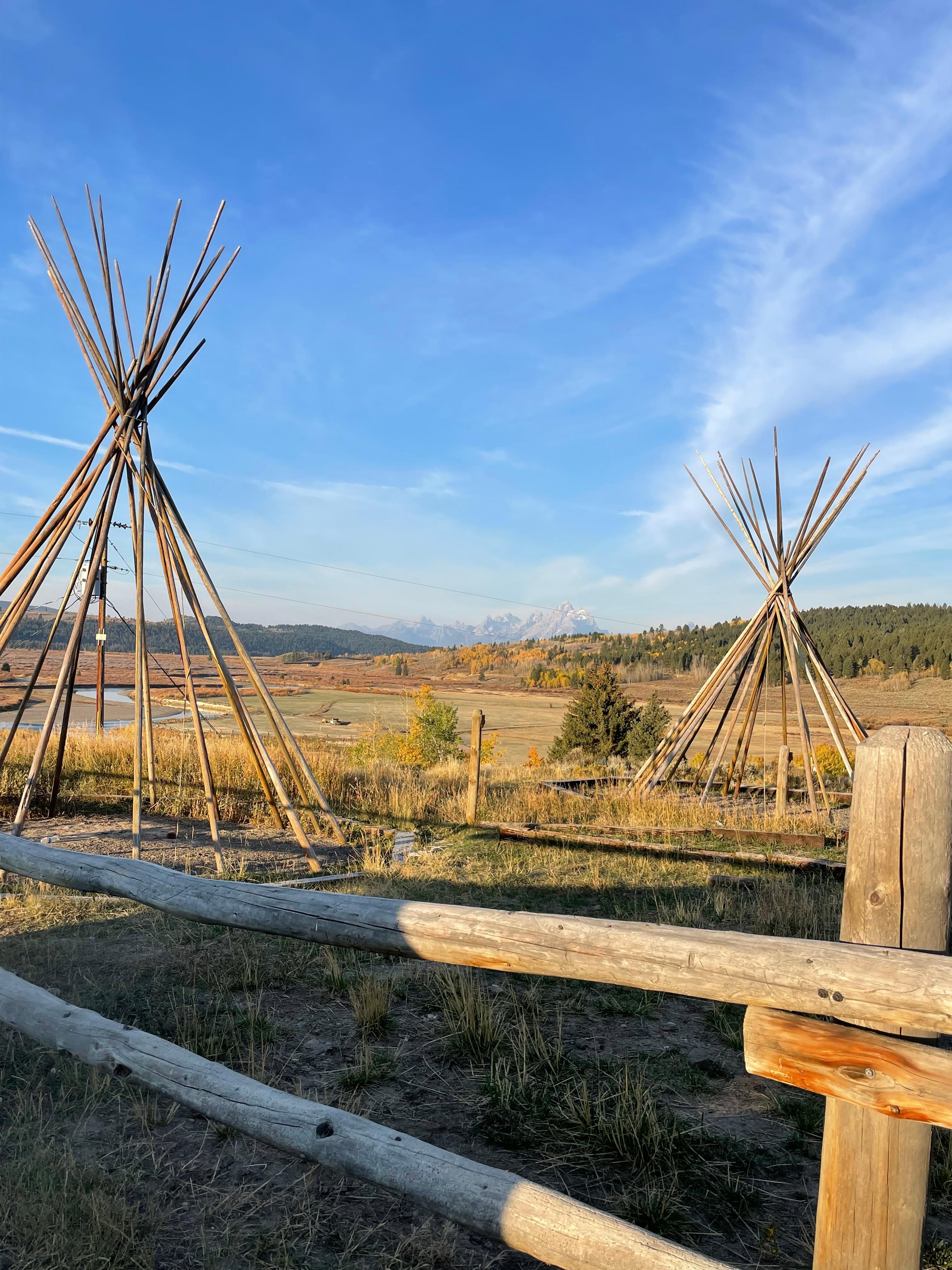 View of tepee poles and Teton mountains