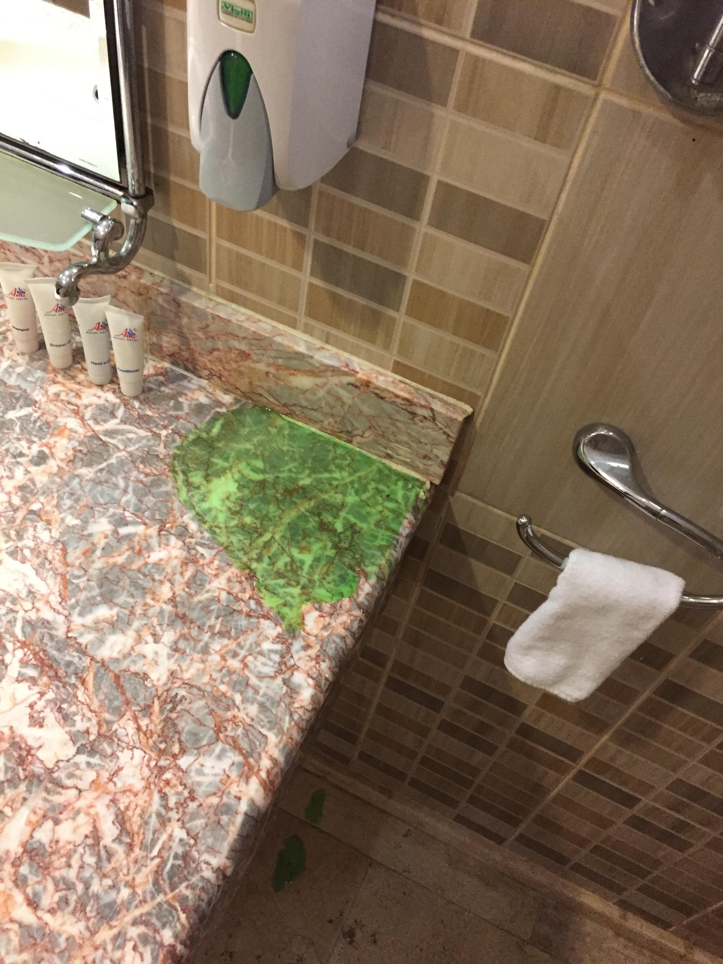 Leaking soap dispenser in bathroom