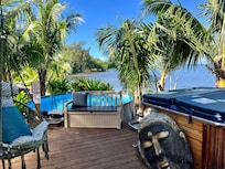 Lovely common area with outdoor kitchen, grill, dining area, pool and hot tub.