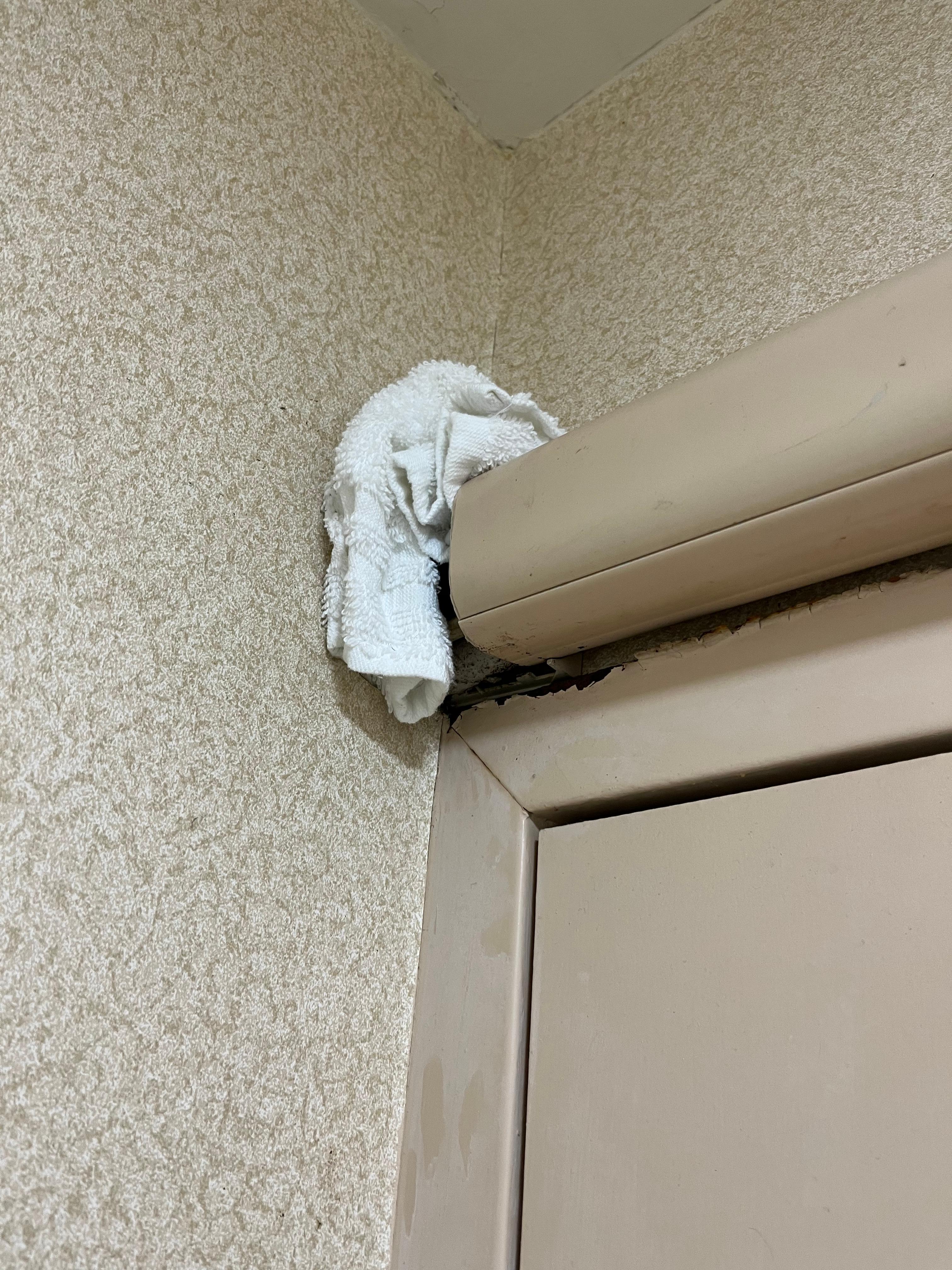 Washcloth stuffed over leaking water pipe?