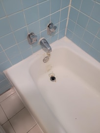 Corroded tub drain w/ badly chipped / damaged porcelain finish