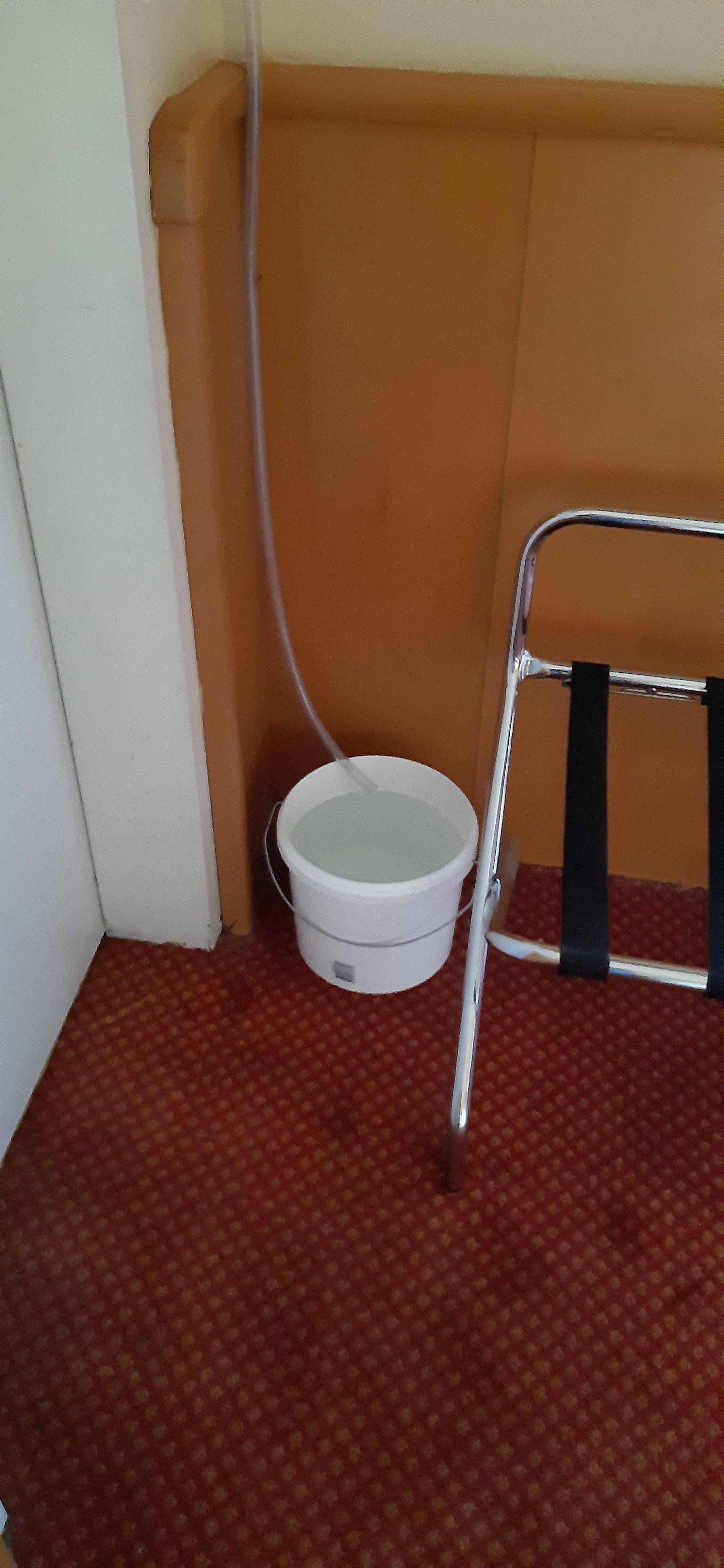 This is water collection from the air conditioner. If you do not pay attention it will soak the carpet (which has probably happened many times).