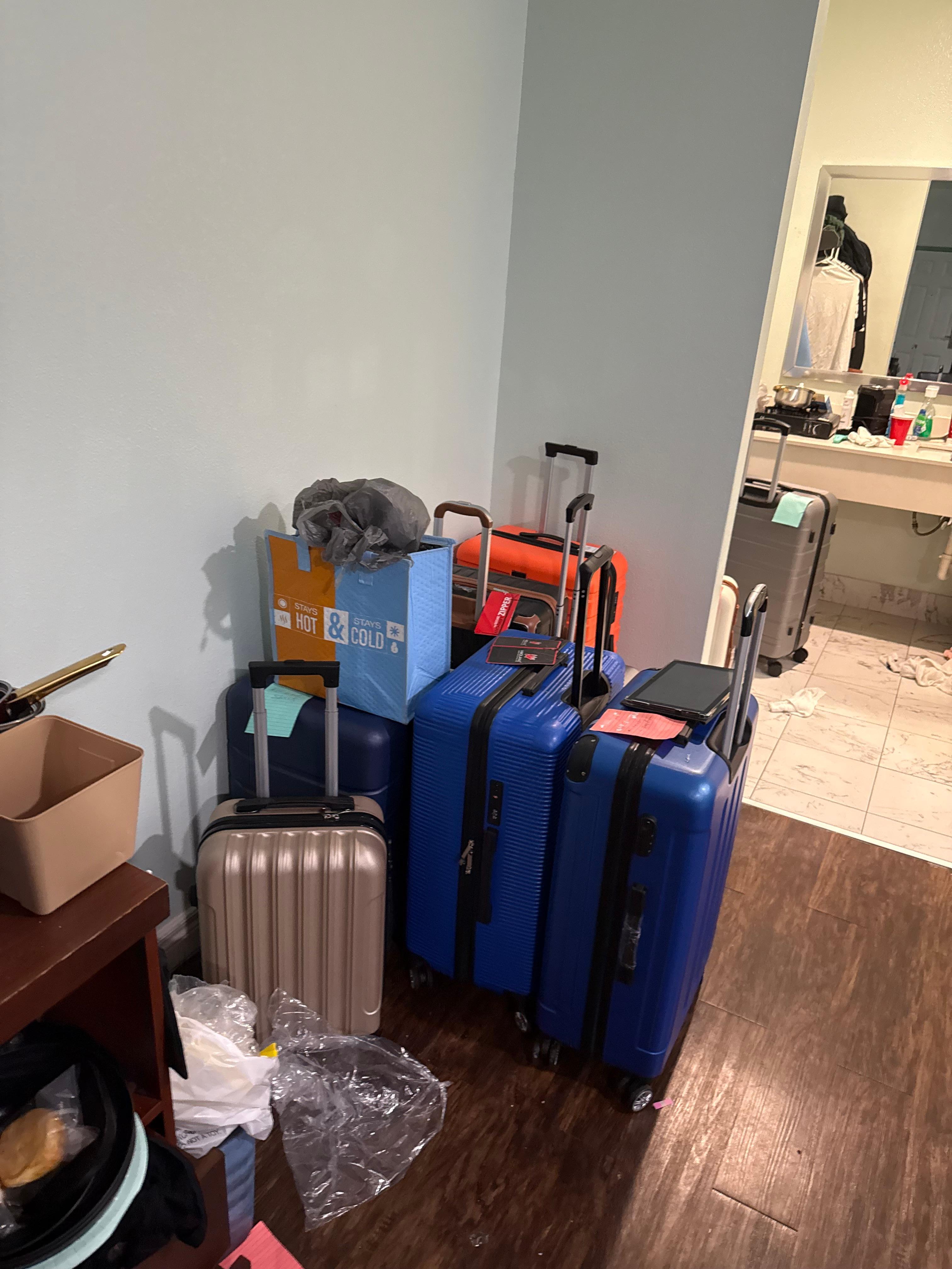 These are my suitcase and belongings I had at the hotel that they refused to let me have a sufficient amount of time to remove all my belongings out of the room I just wanted to pay for another day so I can take my things and they said bo to my odde 