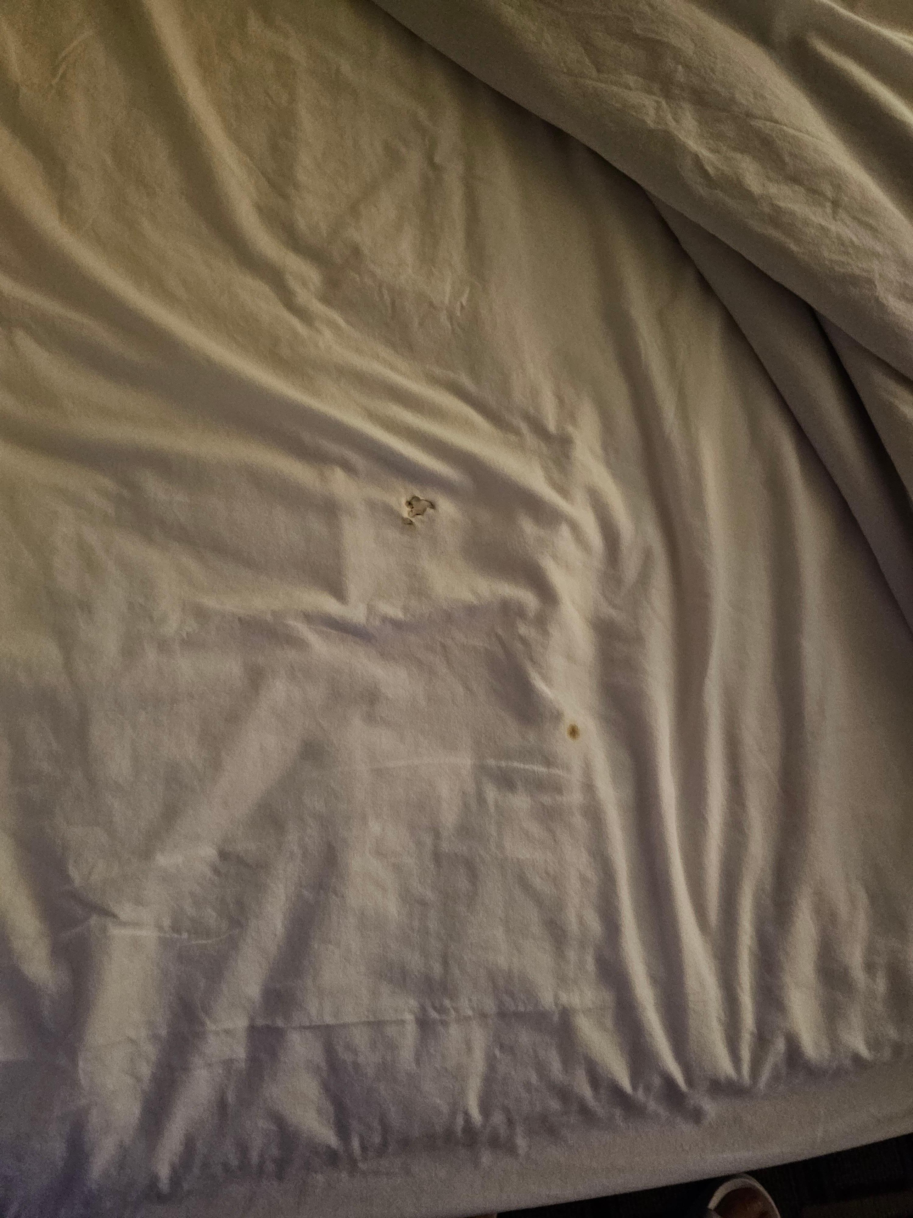 sheets with burn holes