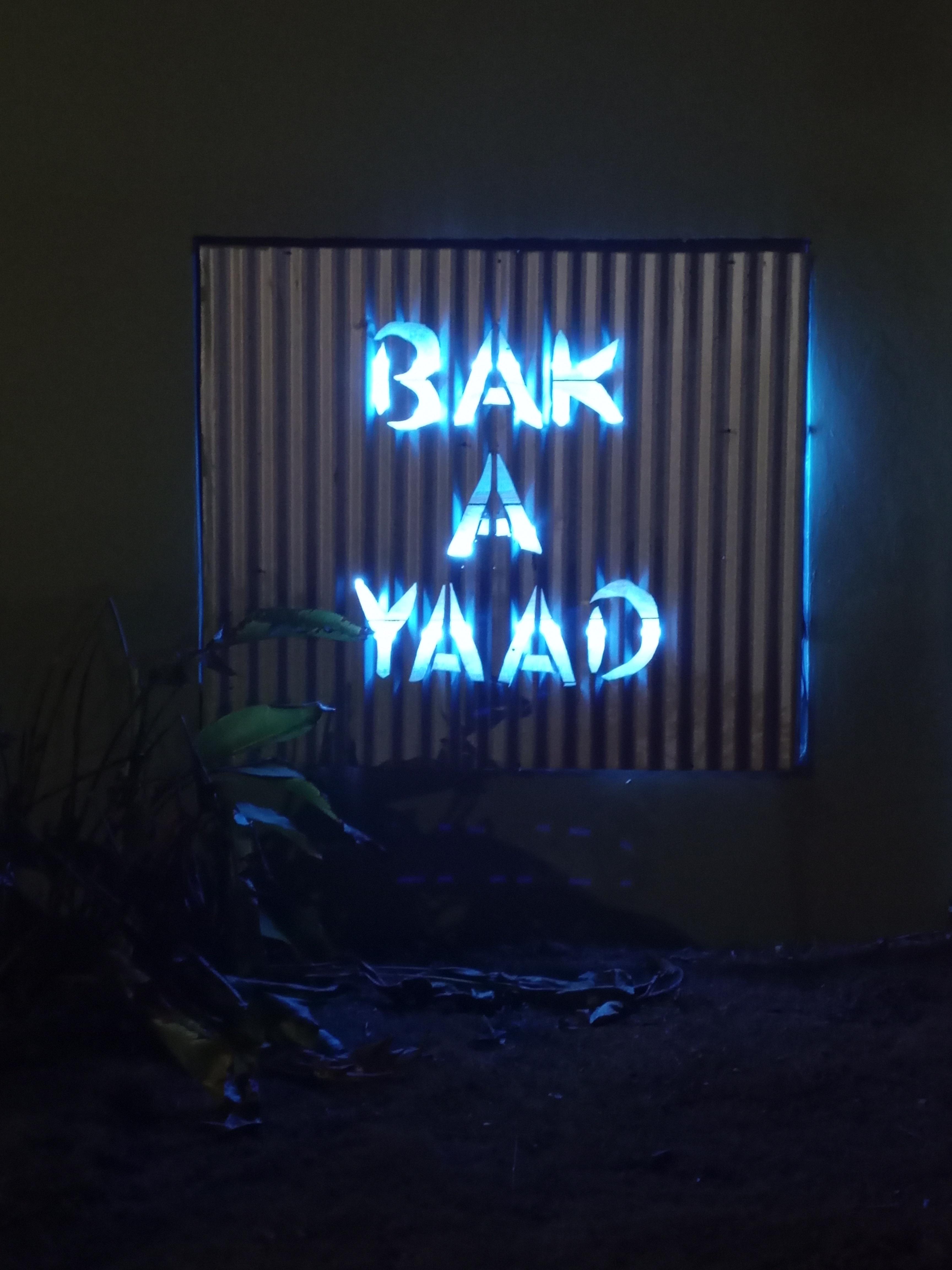 Bak A Yaad sign on the front wall at gate entrance 