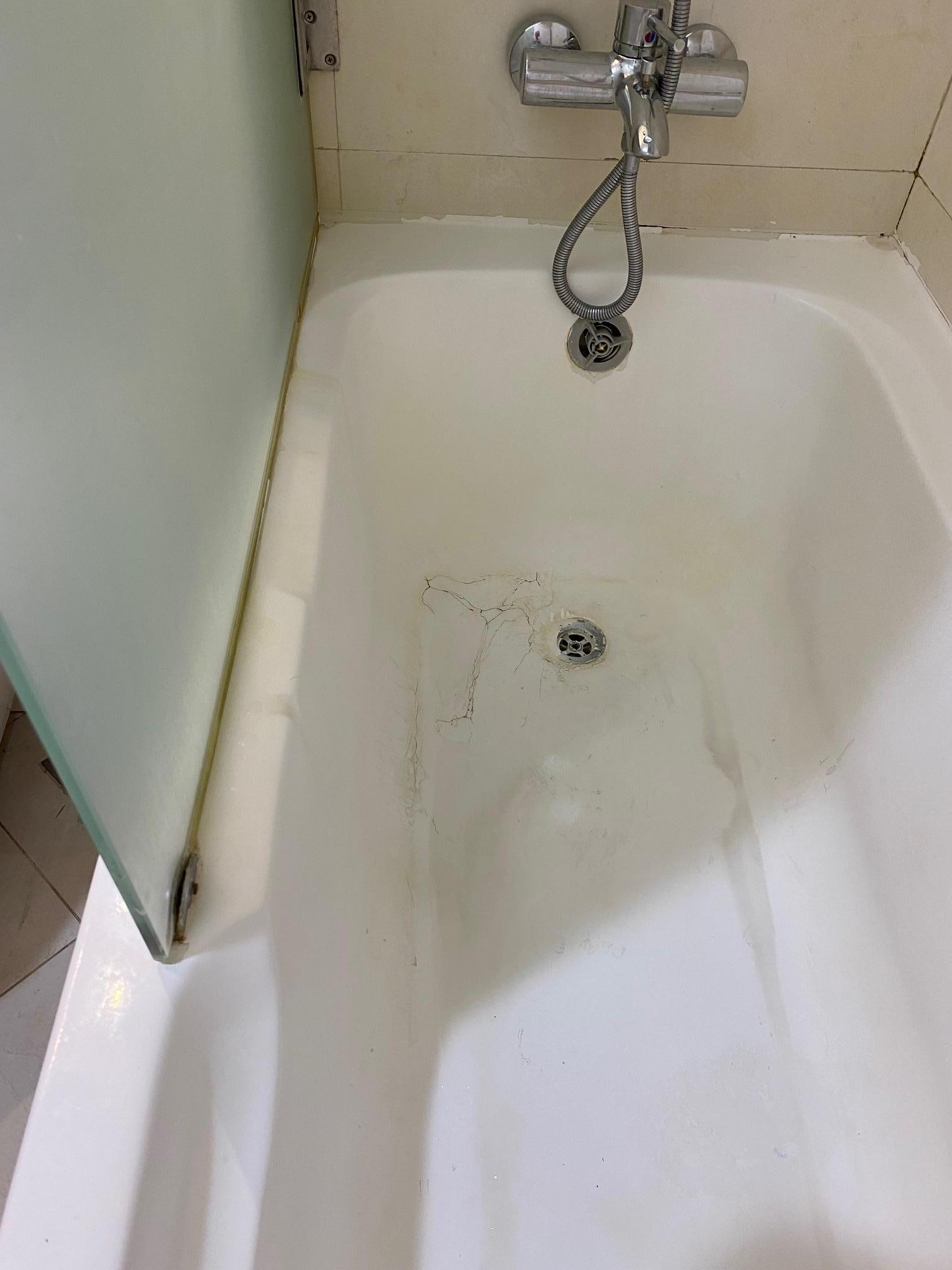 Stained bath and unclean fittings