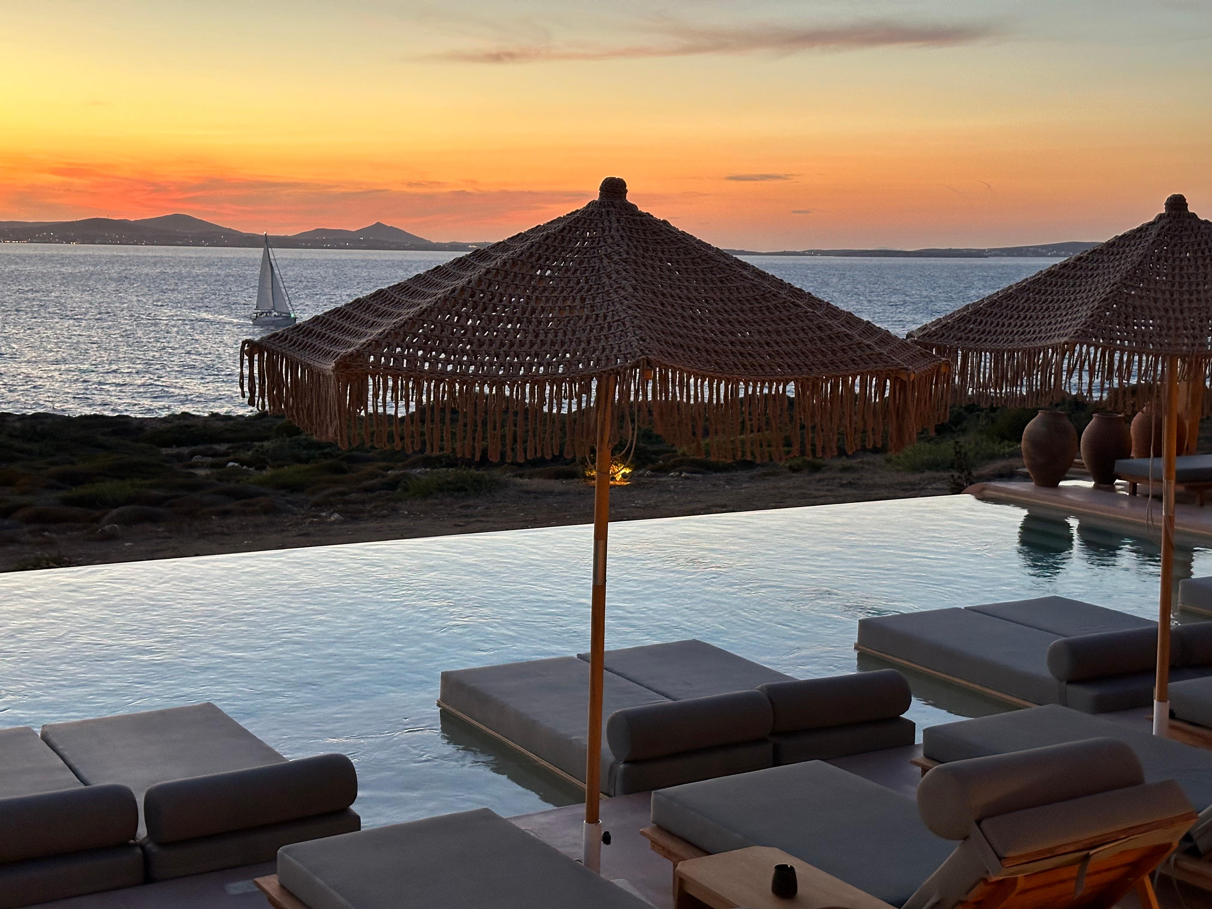 View of sunset behind Paros from the infinity pool.