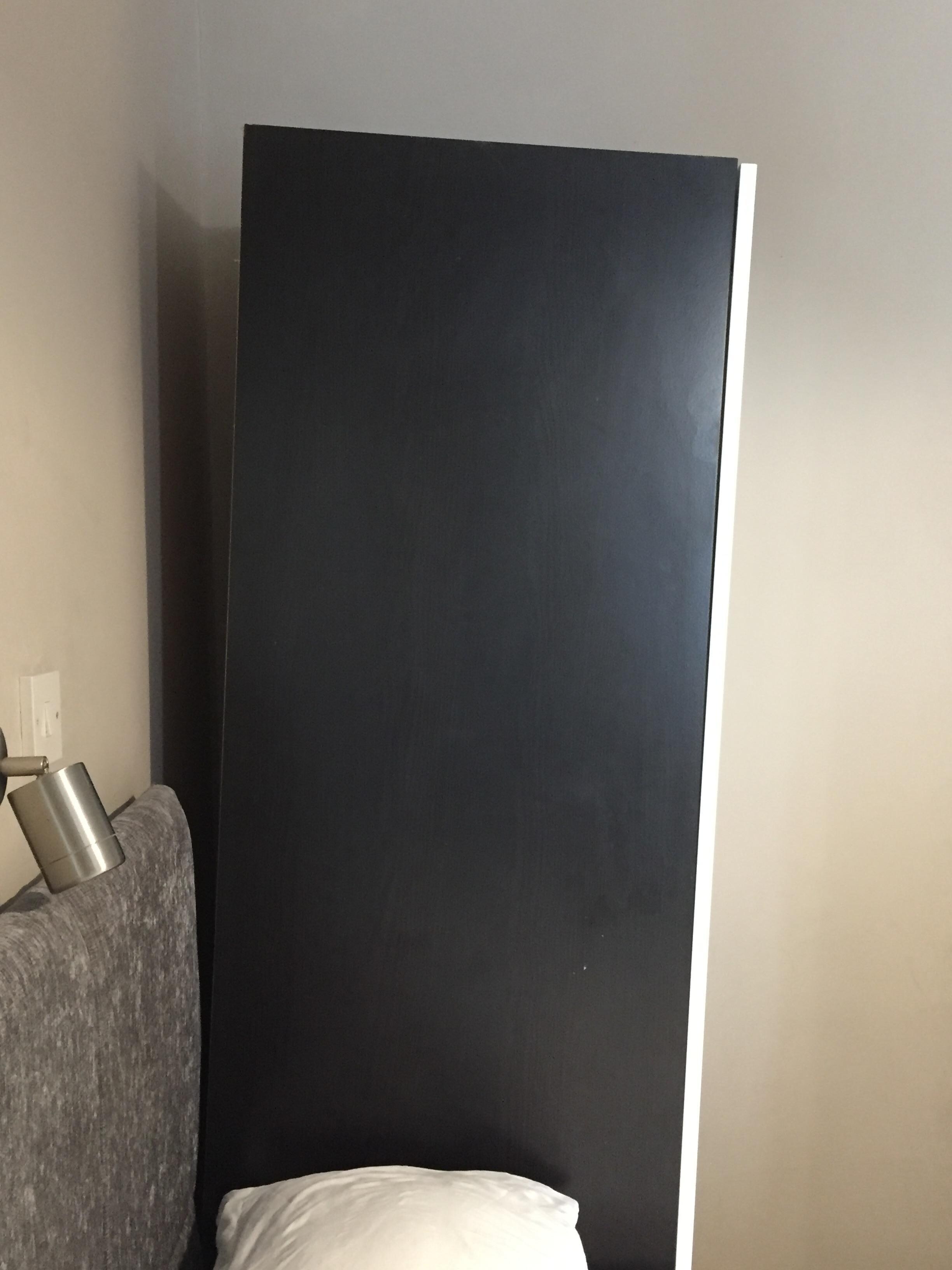 Single wardrobe about to fall over
