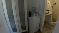Wardrobe, fridge and coffee machine